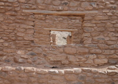 Rough stone wall with a small white rectangular alcove.