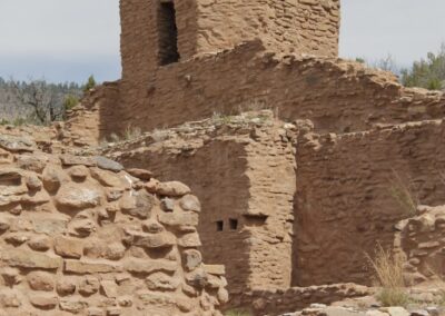 Desert stone ruins with a tall, crumbling tower.