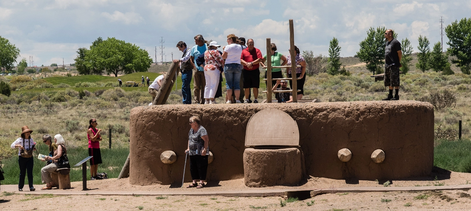 VisitCoronado Visitors explore a reconstructed adobe kiva at Coronado Historic Site