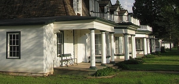 A row of white-painted officer quarters at Fort Stanton Historic Site.